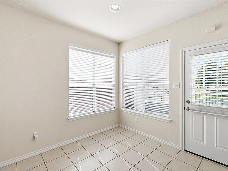Spacious and surrounded by windows. Open to backyard and of course to kitchen and living room