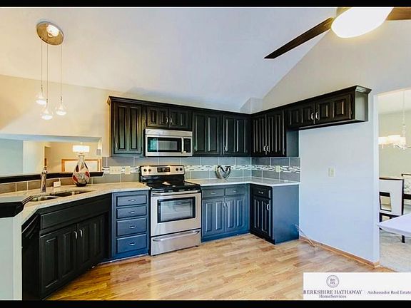 Kitchen with Granite countertops. Does include a stainless steal refrigerator