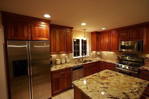 New kitchen with cherry cabinets, granite, and stainless steel appliances
