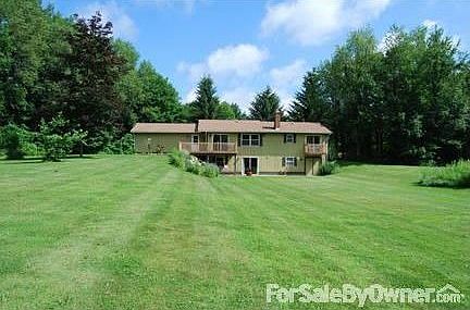 Back View
						:
						View of the back of the house, from the entrance to the woods.
