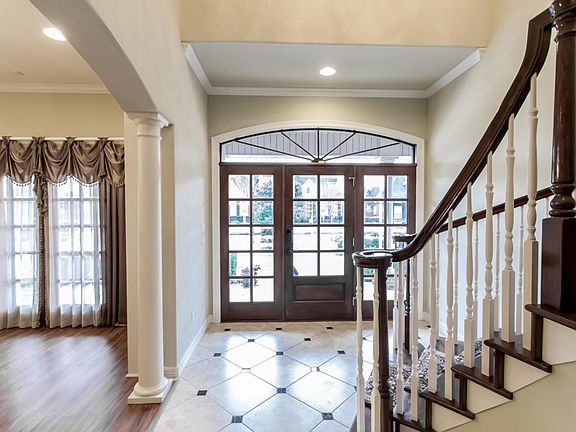 entrance, dining room and grand staircase