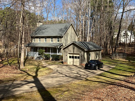 View of home and property from the street. One car garage.