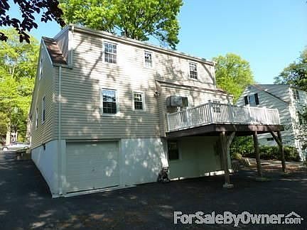 Back of house
						:
						Note the new driveway, new drain, and Trex deck.