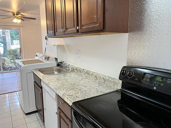 Kitchen with full size washer/dryer