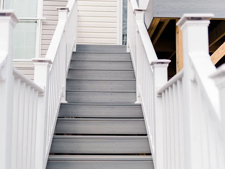 Looking up back deck stairs from backyard