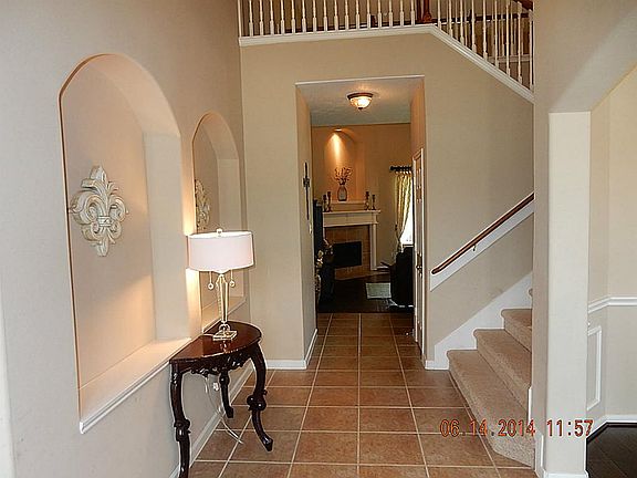 The foyer features tile flooring and two story entry.