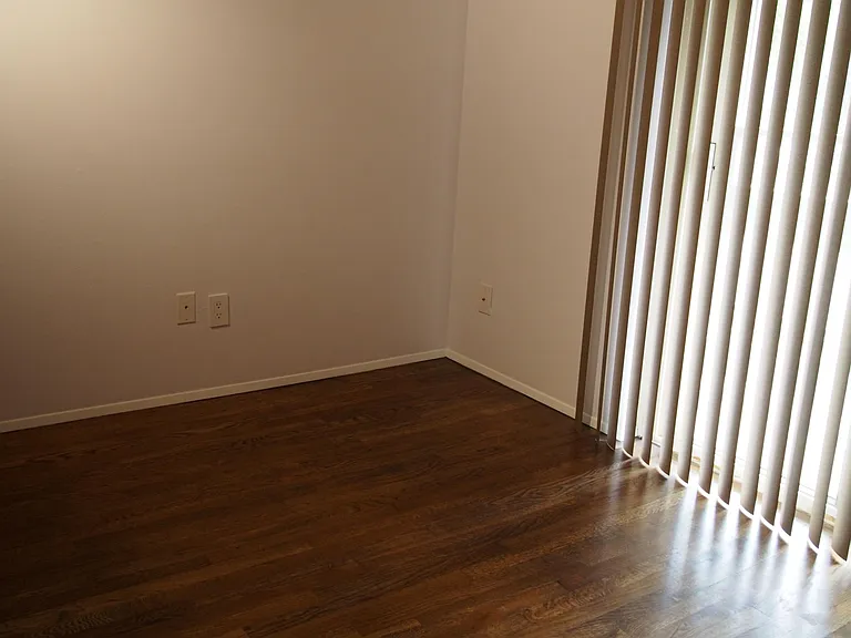 Second bedroom with balcony and refinished floor