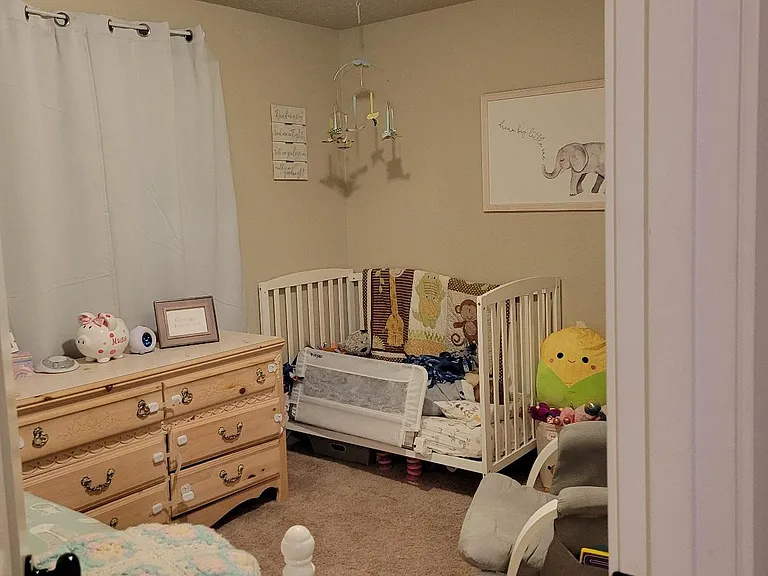 The secondary bedroom has room enough for the two children.