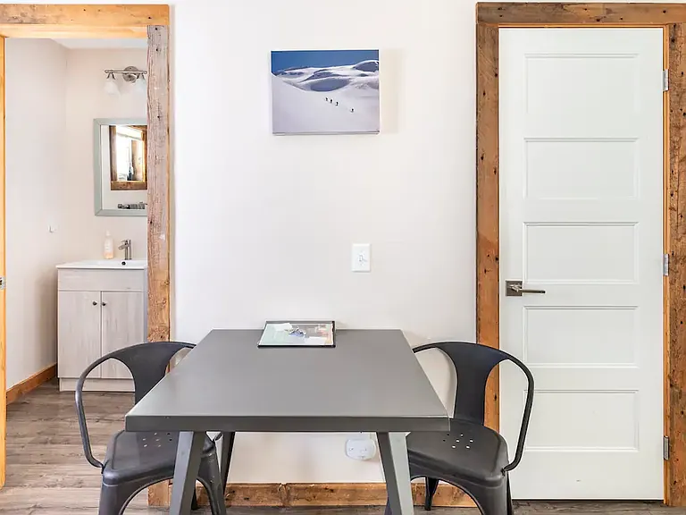 CLosed door is to Laundry washer and dryer.