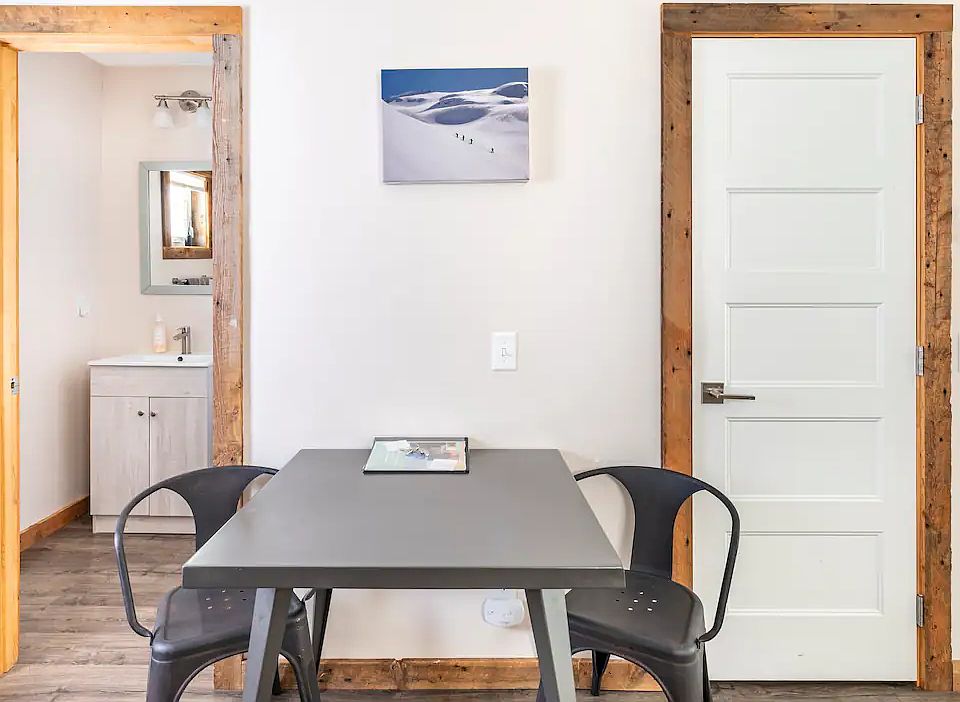 CLosed door is to Laundry washer and dryer.