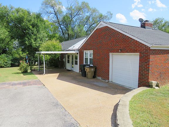 Back of the house with garage and patio