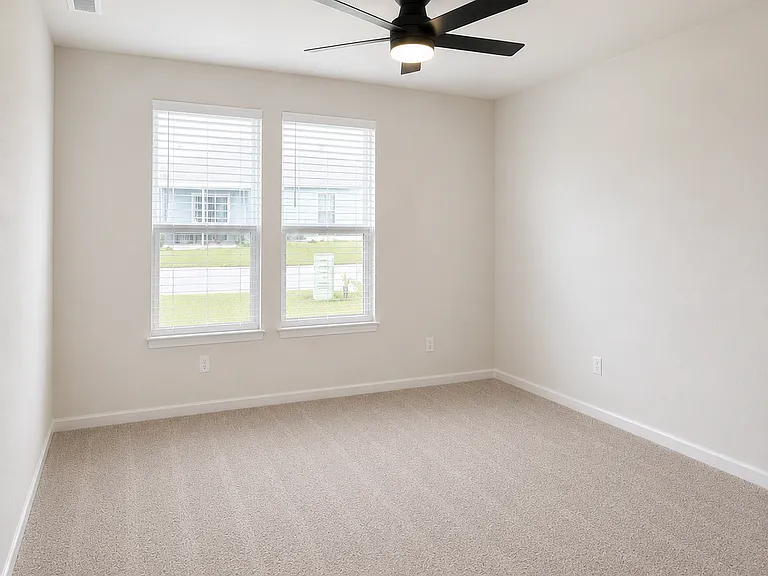 Large master overlooking backyard with attached bathroom and walk in closet