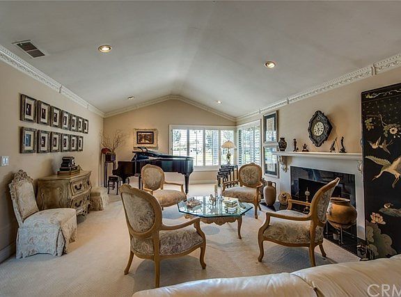 Elegant Great Room with granite-trimmed fireplace.
