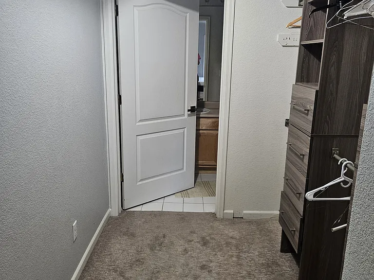 Bedroom 2 with build in dresser and hangers