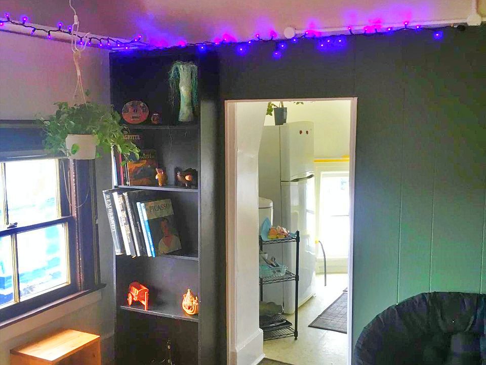 The living room, with the entrance to the kitchen.
