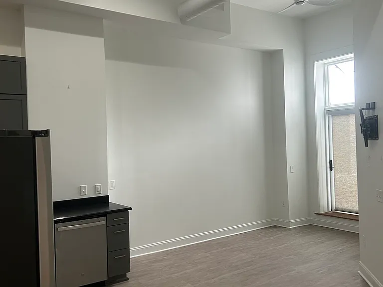 Living area with TV mount. Wifi included.