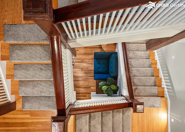 View from loft stairs down 2 flights to foyer