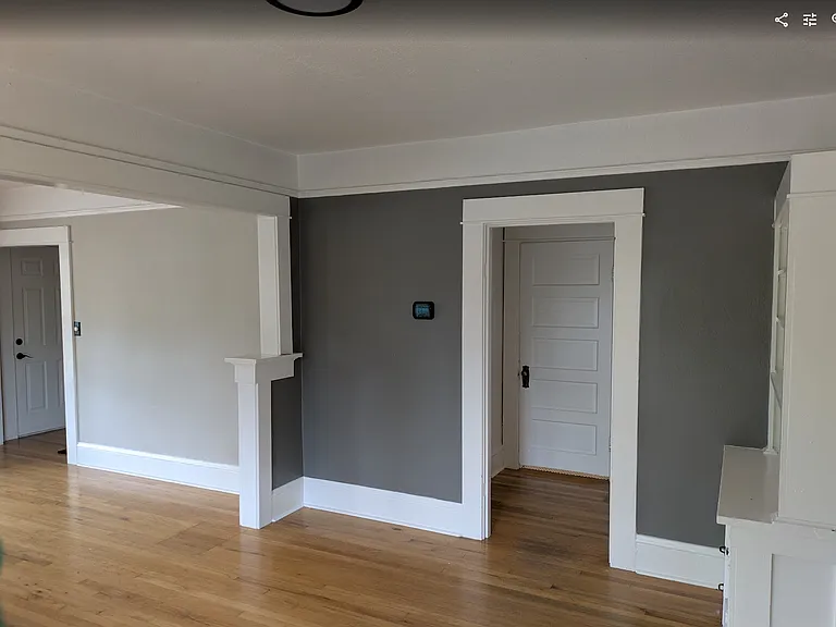 Dining room, door to bathroom and downstairs bedrooms