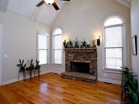 Family/Keeping Room with Vaulted Ceiling & a Beautiful Stacked-Stone Fireplace