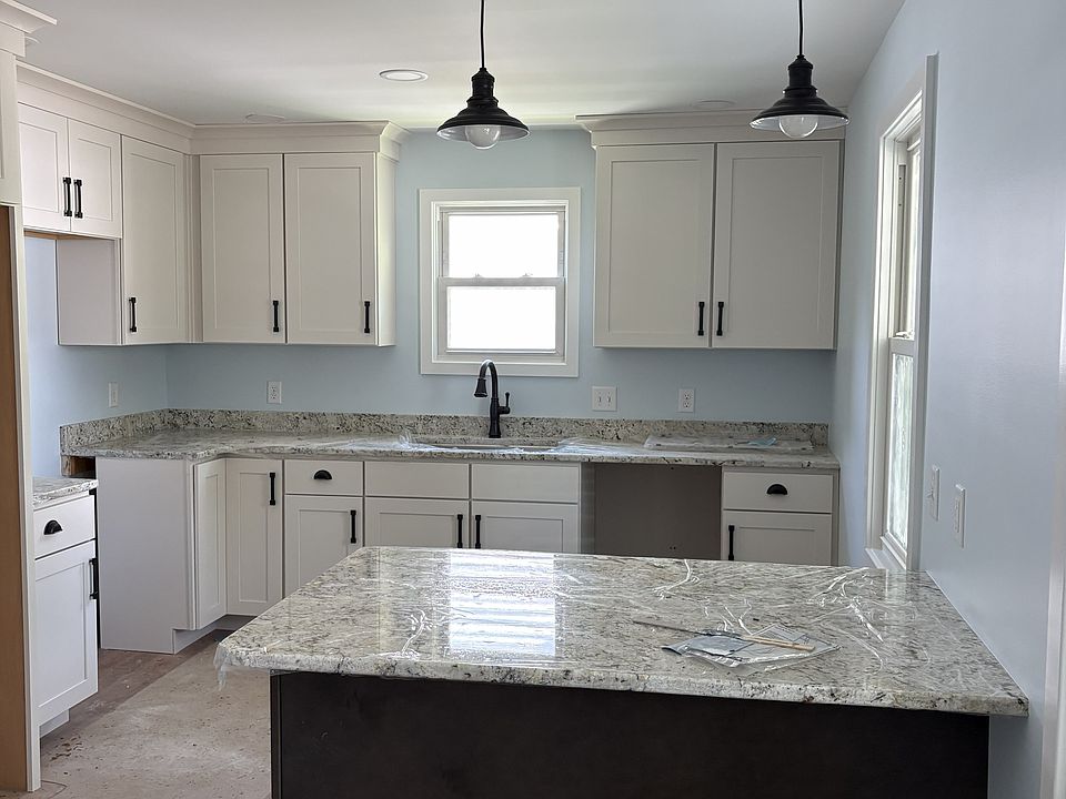 Kitchen with peninsula (like an island but one end is built into the wall)