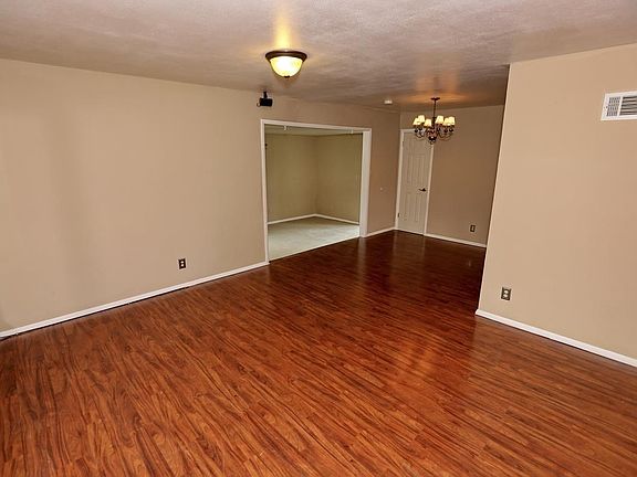 Enter the spacious living room from the covered front porch