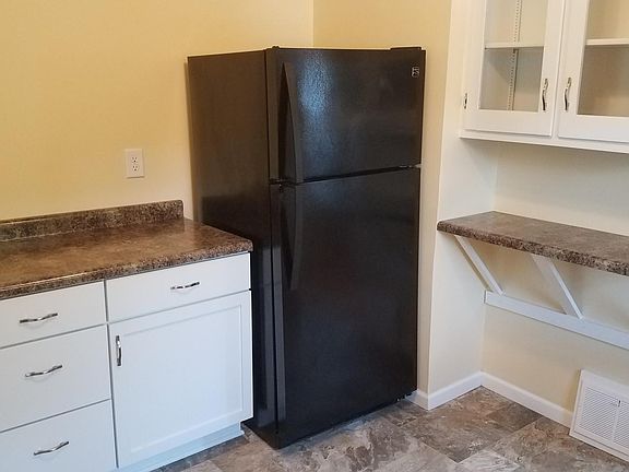 Fridge and meal/cocktail prep space