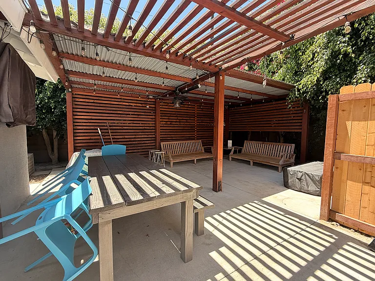 backyard space with fire pit and large table and chairs