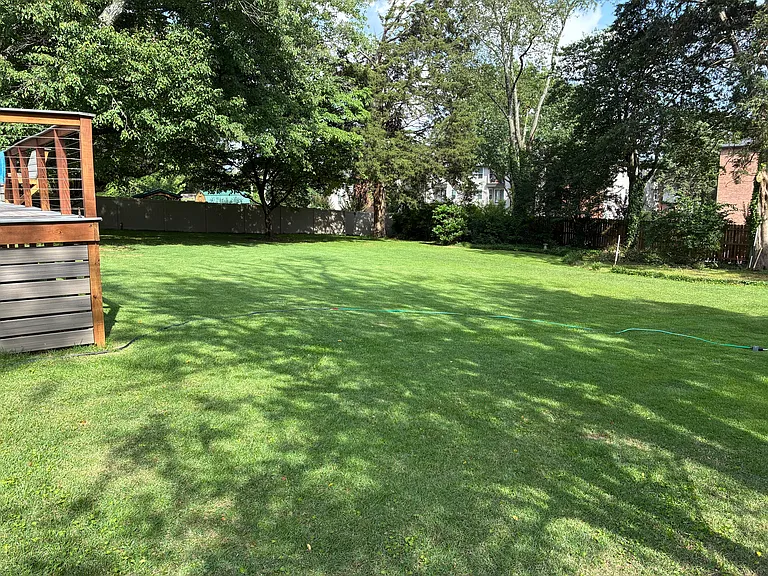 Large level back yard with pretty good and getting better privacy.