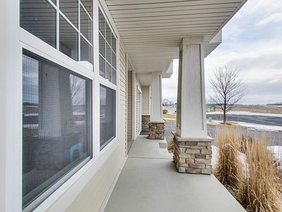 Charming front porch to relax and enjoy the neighborhood.