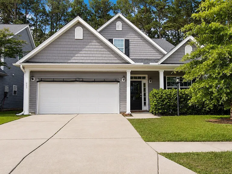 View of the front with drop down garage screen.