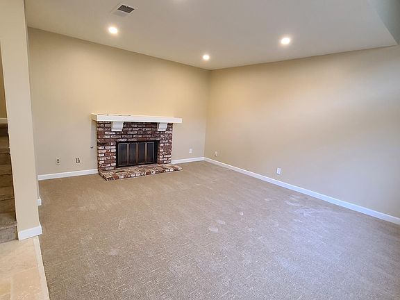 Living Room with Fireplace and Canned Lights