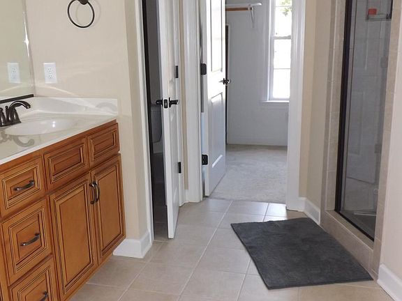 Master Bath and her walk in closet