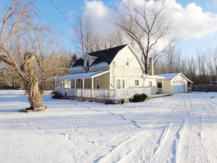CHARMING FARM HOUSE WITH A WRAP AROUND FRONT PORCH!! Detached 2.5 car garage with a new door opener. This home has many updates and is as cute as can be! New shingles 2008. Newer windows and entry doors. Updated kitchen and bathroom. New laminate flooring in the kitchen, dining area, and family room. Freshly painted interior and some new lighting fixtures. City water. Close to Bullock Creek Schools, Chippewa Nature Center and the Rail Trail!! Move in ready!!
