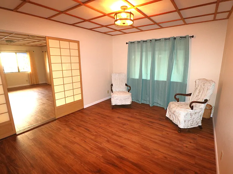 Separate dining room with slider shoji doors to living room