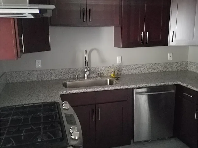 Beautiful new kitchen w/ espresso shaker cabinetry, granite counter tops, and stainless applainces.