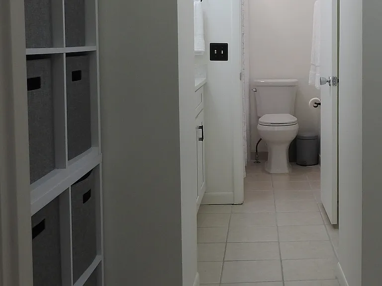 Long view from bathroom door to primary bath
