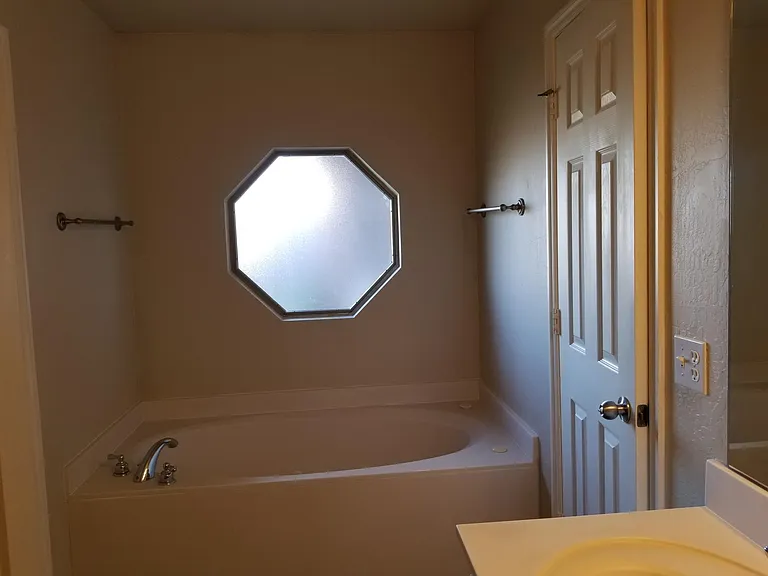 Jetted tub in master bathroom.