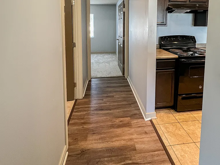 Hall between bedrooms and living space. Makes bedrooms feel more private.