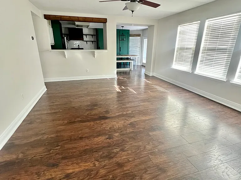 Living room with fan and electric fireplace
