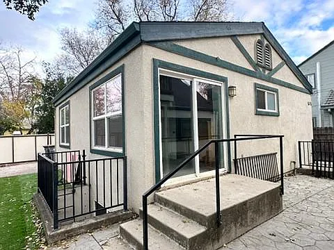 Back of the home. Bedroom #1 has a sliding glass door to private back yard area. - 532 F St