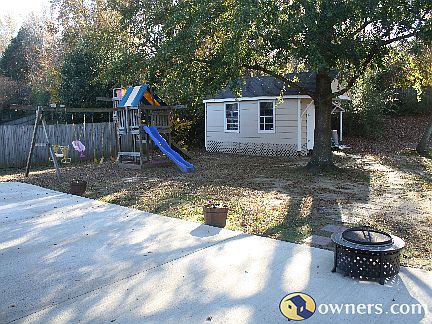 Back patio, swing set, & shed