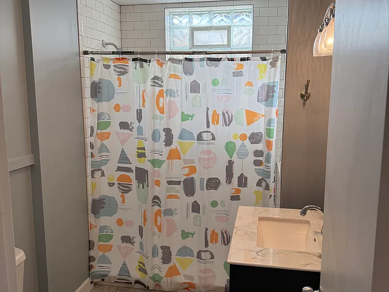 Full private bath with walk-in shower on lower level