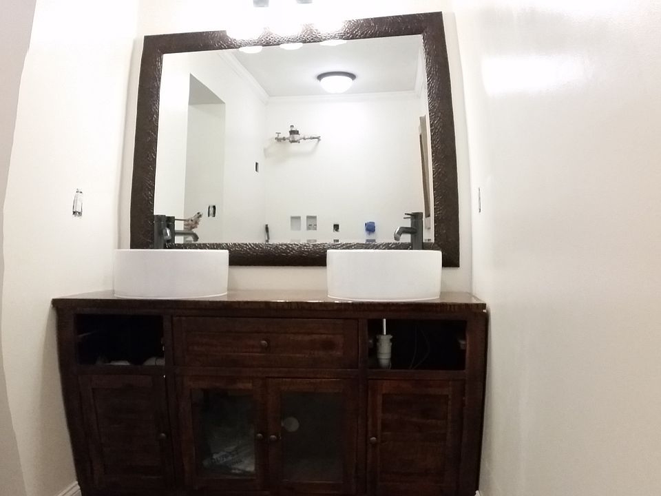 New vanity, sinks, and mirror.