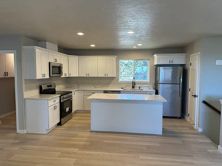 Open Kitchen with lots of pantry, classy quartz countertop, island, lots of cabinets and brand new appliances