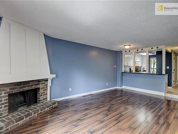 White trim, white fireplace compliments the darker hardwoods