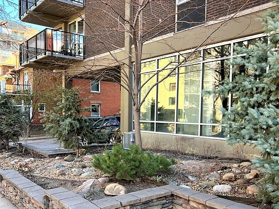 LOVELY LANDSCAPED FRONT OF BUILDING