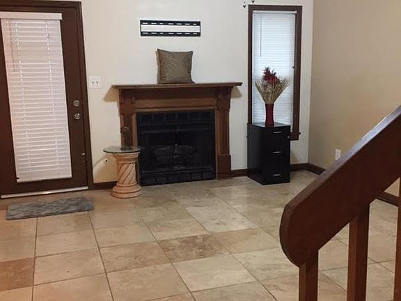 All tile downstairs. Real Fireplace!