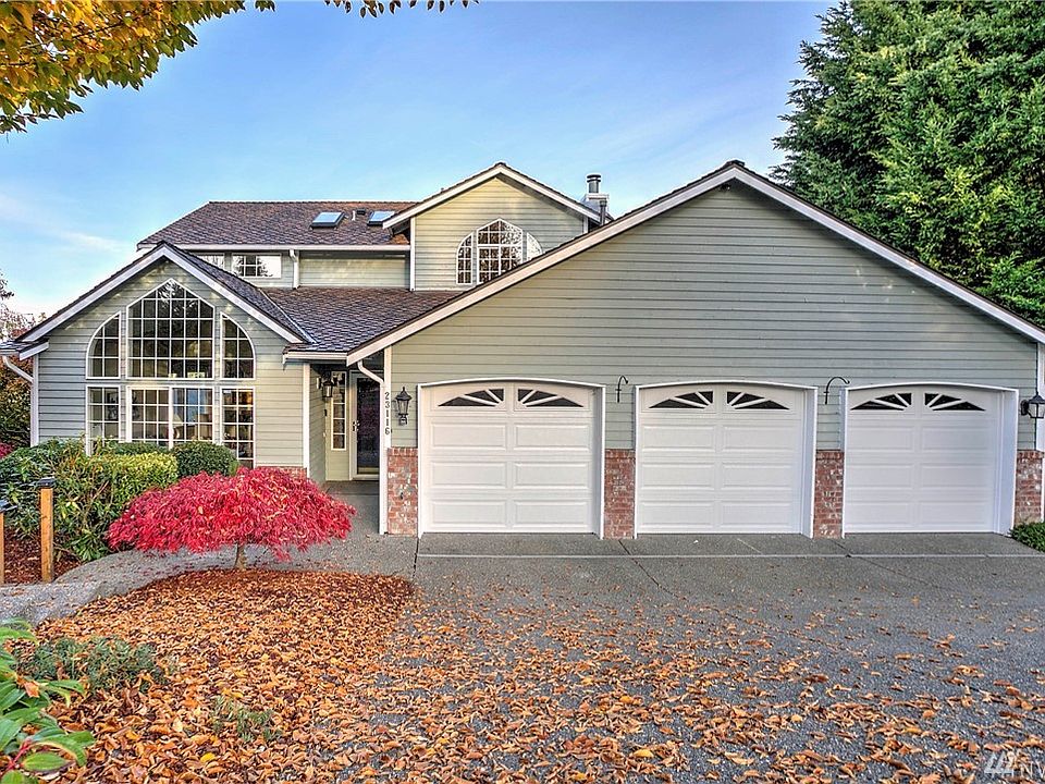 Welcome home to this spacious 4 bedroom, 3 bath home in the desirable Highlands of Lake Wilderness. A lovely entry greets you with vaulted ceilings and hardwood floors. Allow natural light to flow through the formal living and dining room with large bay windows. Enjoy the eat-in kitchen with a garden window and brand new stainless steel refrigerator. Stay warm and cozy in the family room with a brick fireplace and double doors that opens to the eat-in kitchen area. Extend your living outdoors to the entertainment sized deck and stunning sunset views.