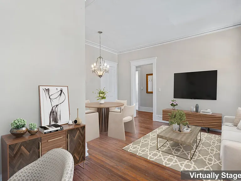 Picture of virtually staged living/dining room from back of room