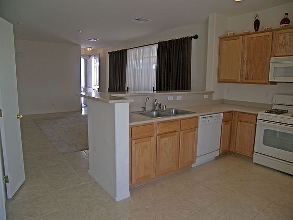Kitchen w/corian counters and newer appliances.